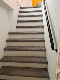 The incline of the stairs is very steep with narrow steps.