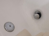 Standing water in the bathtub.