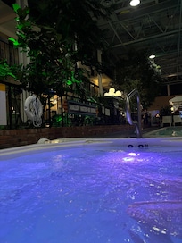 jacuzzi lights up the courtyard during evening hours