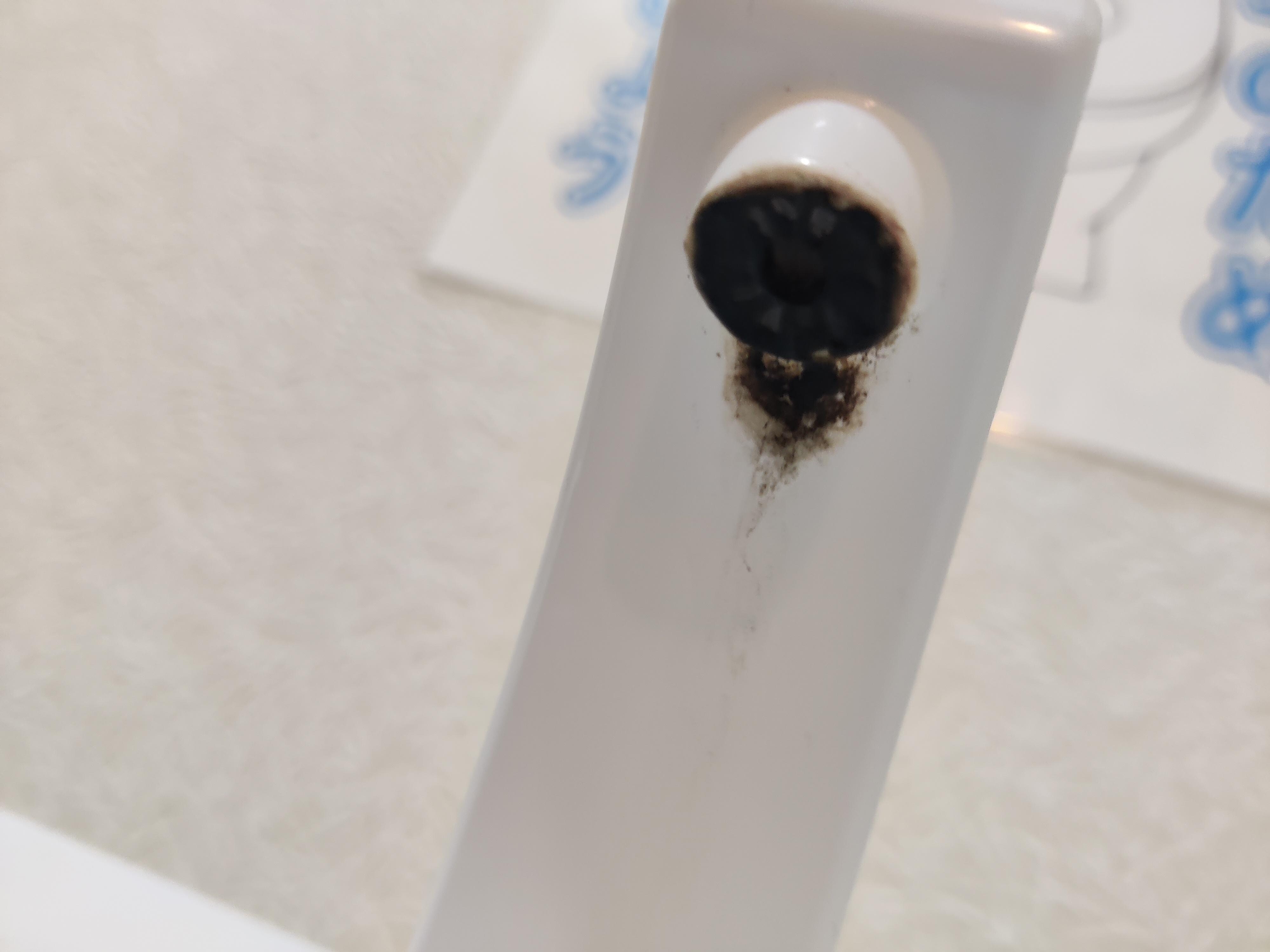 Moldy over toilet sink faucet