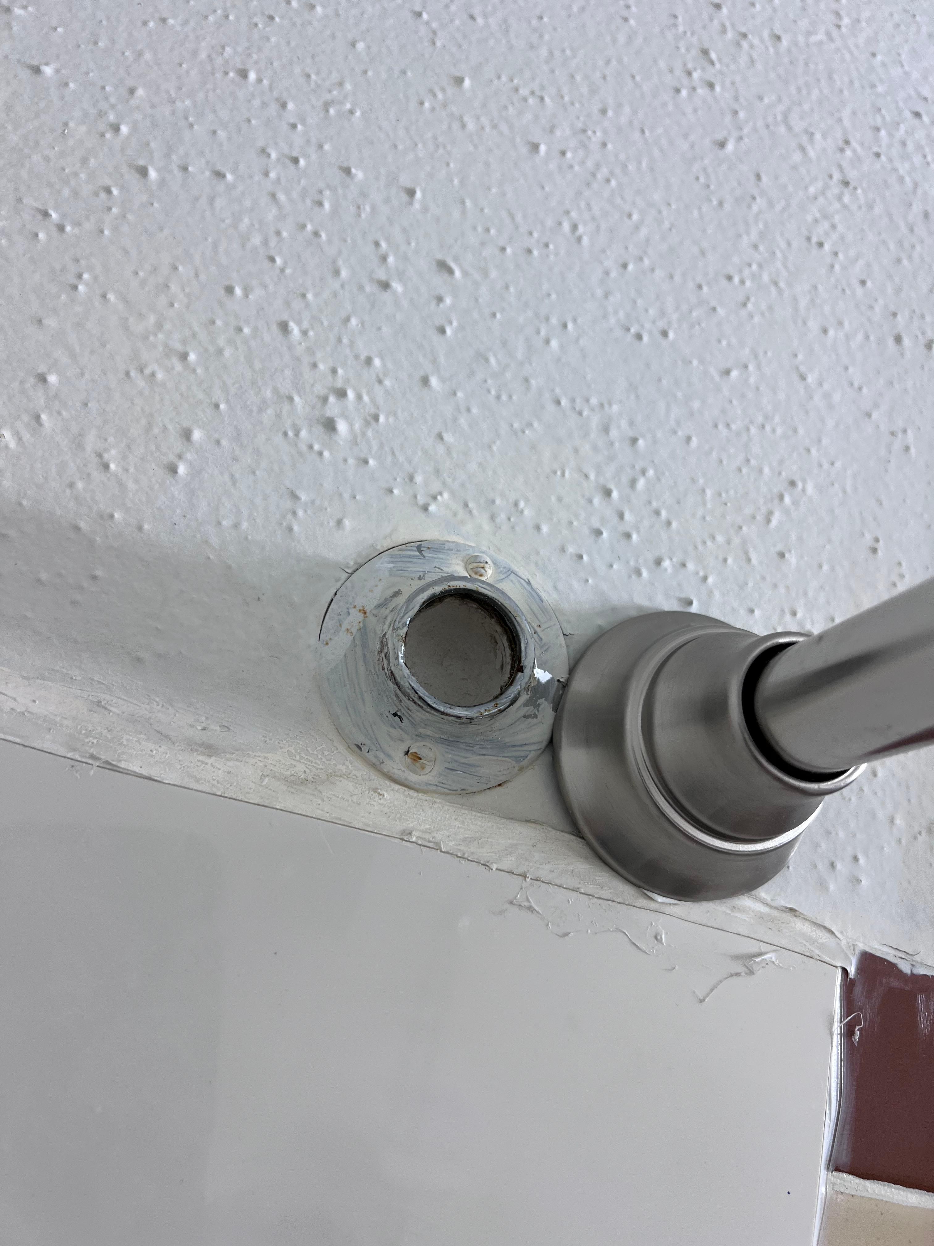 Old curtain rod bracket left and painted over 