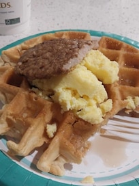 Nice hot wafles eggs and sausage