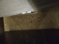 Carpet between the bed and night stand.