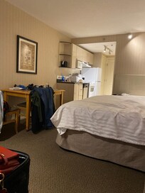 Queen bed - dining and kitchenette.