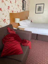 This is how the bed was made in the morning - the blankets should be on the bed