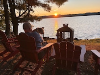 Man and dog enjoy peaceful setting