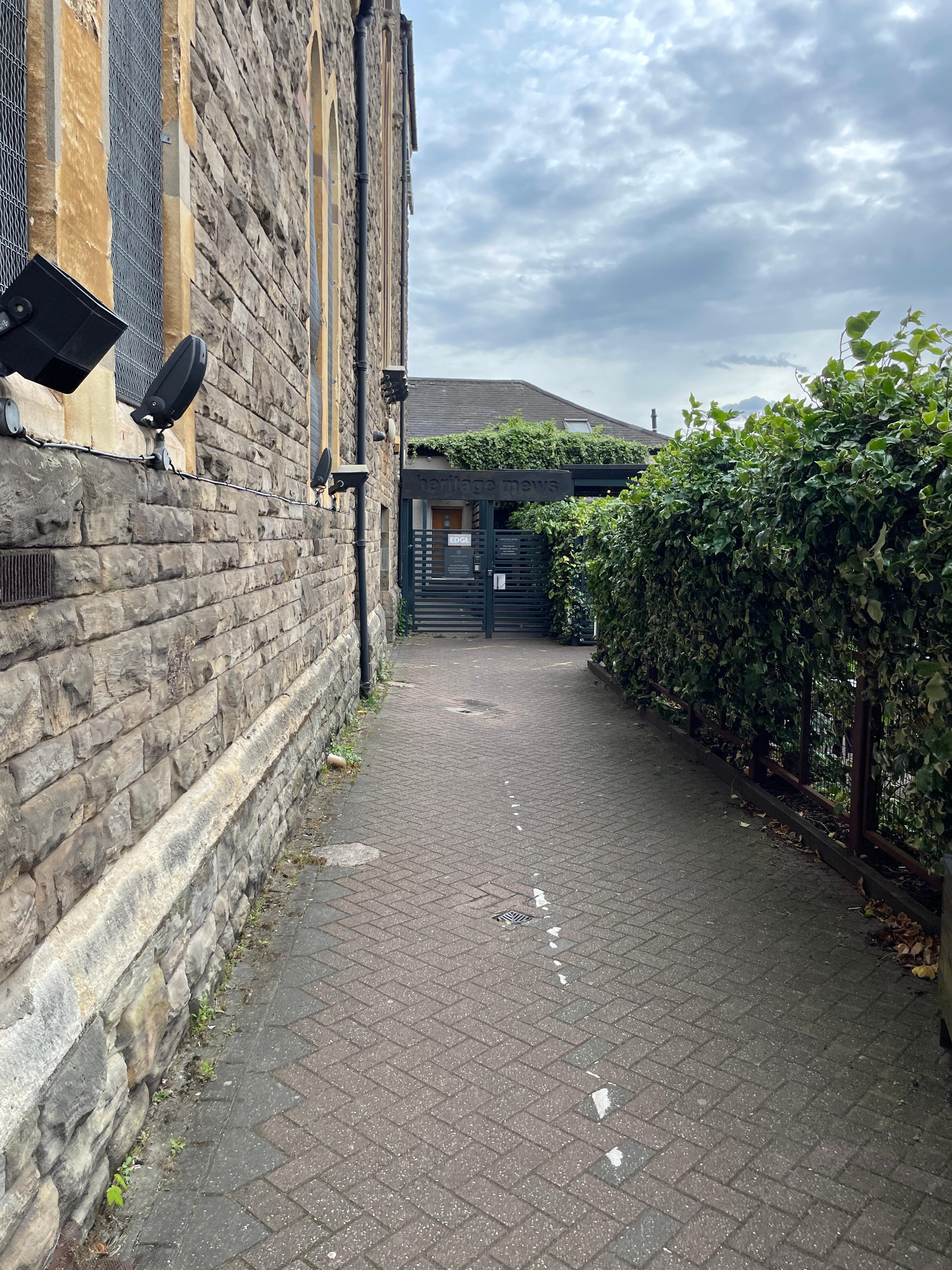 The enterance next to Pitch and Piano with keycode gate