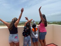 Kids saying bye.