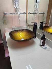 Very nice sink and soap amenities.