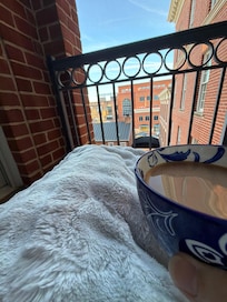 Coffee and a warm blanket on my balcony in the morning