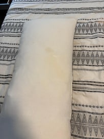 Throw pillow in primary bedroom