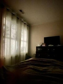 View in main bedroom at night due to street lamp