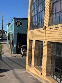 Lower level garage, upper level flat, other building is local brewery