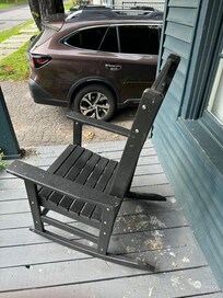 Amazing amount of bird droppings covering porch and chair.
