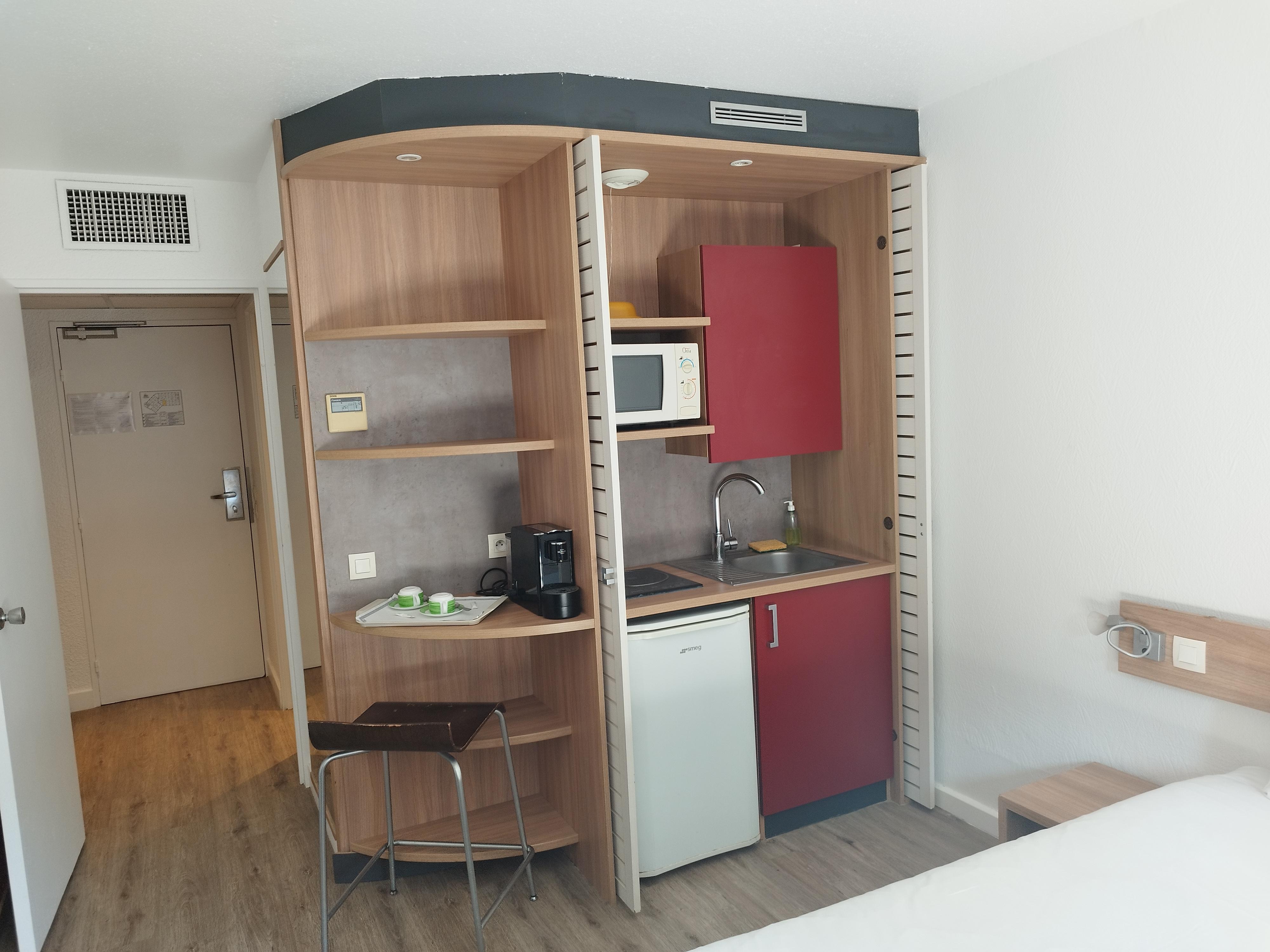 Room with a kitchenette. 