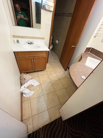Dirty towels on the floor.