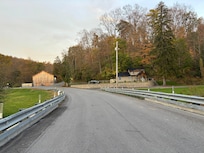 Looking back from across the street by the creek