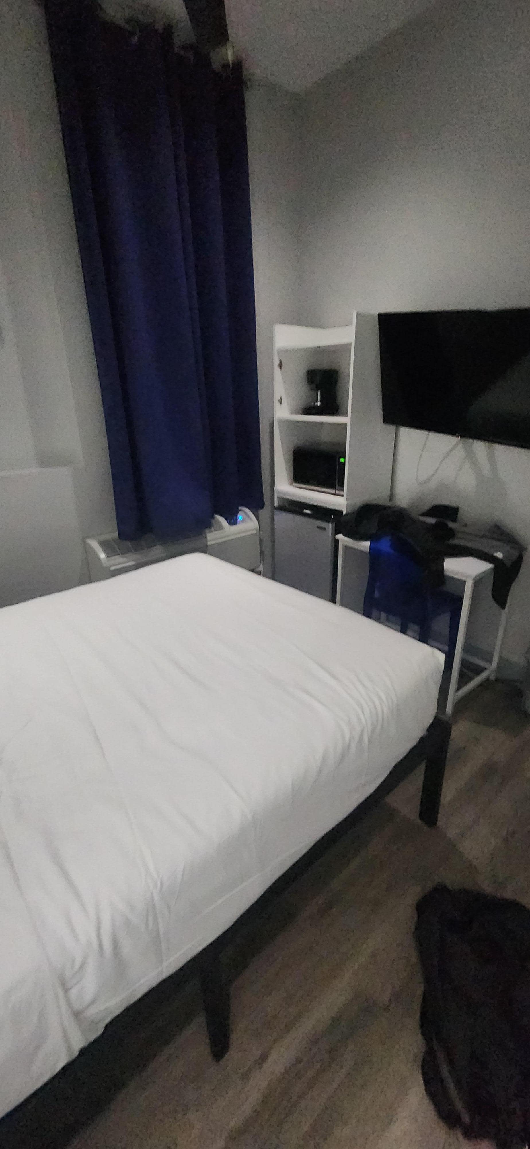 Cheap furniture, horrid wall art. Commercial tile floor. Clean 