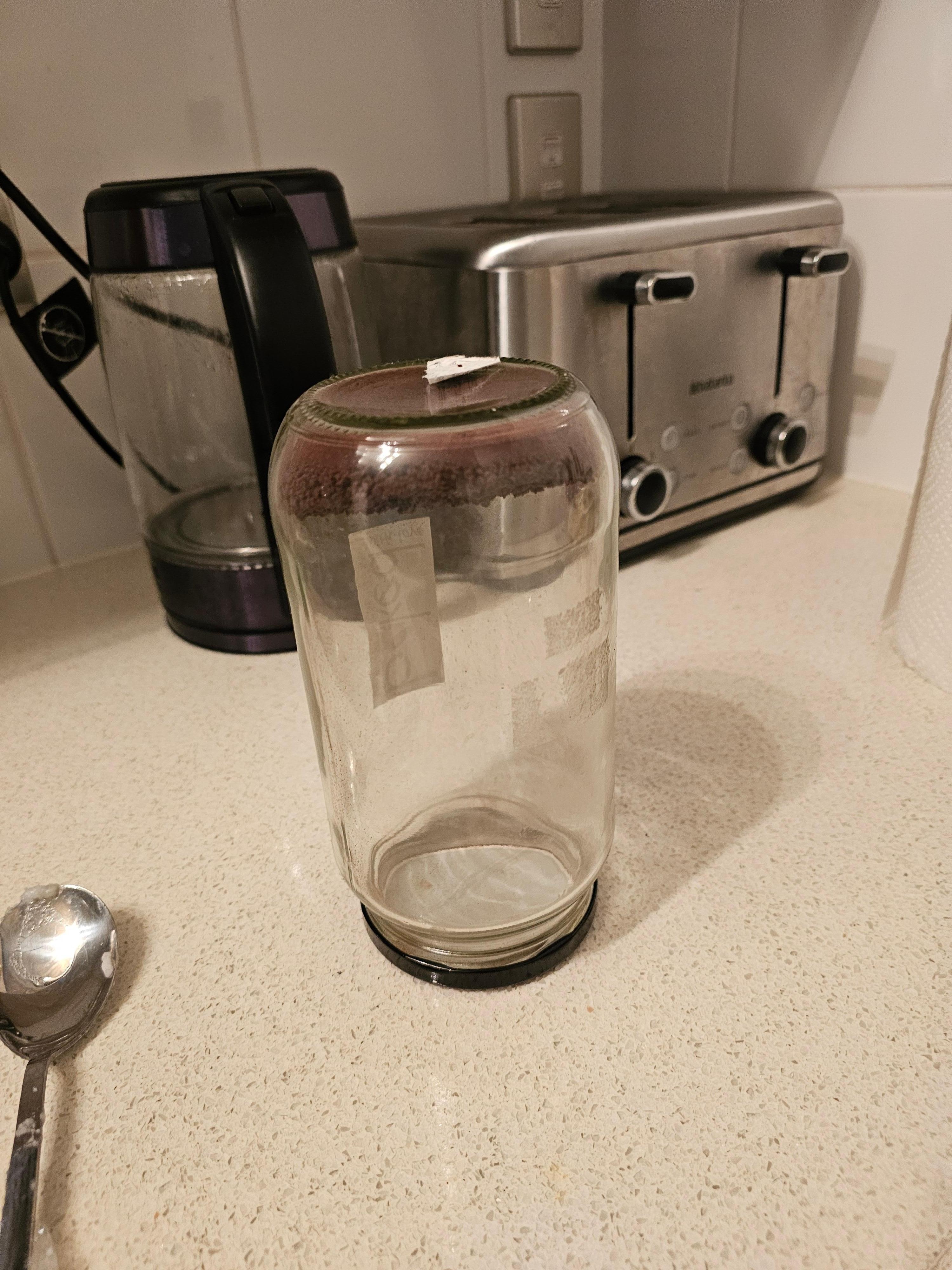 Stale coffee in upside jar