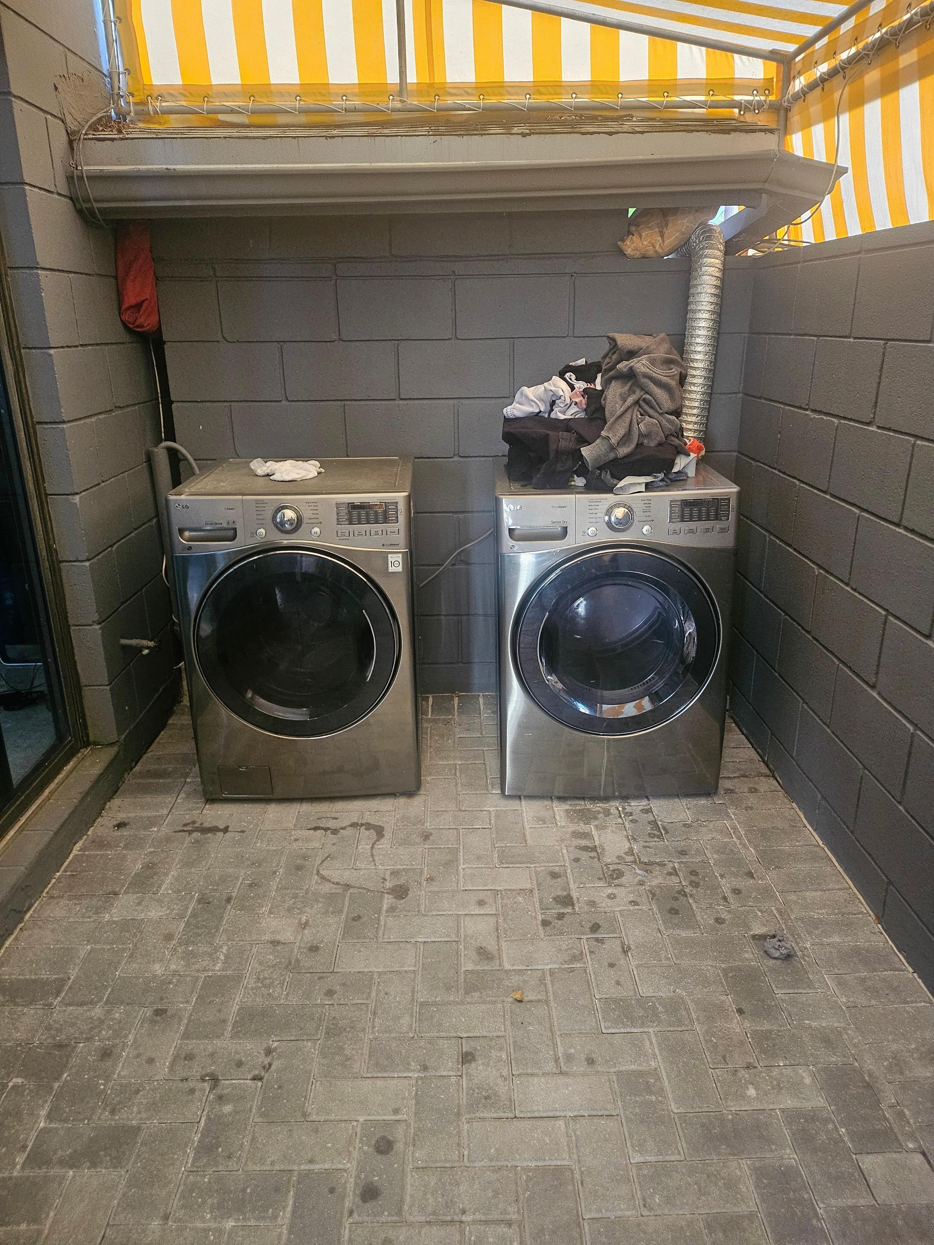 Someone else's laundry found in dryer and lint trap full and no laundry detergent available to use.