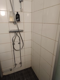 Shared shower completely black from mold.
