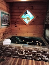 Picture of bed showing mattress falling into the broken frame and box spring