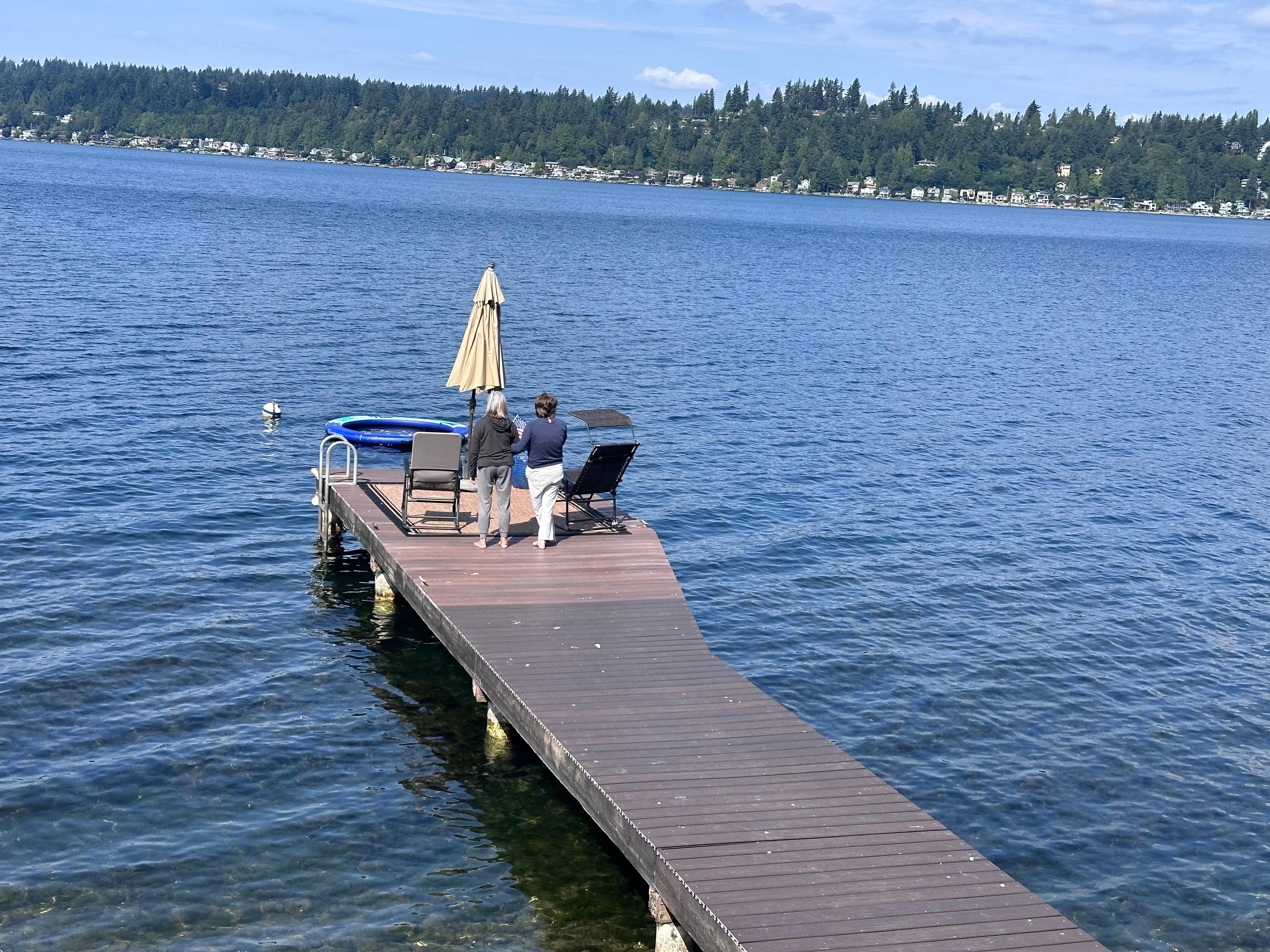 View from the deck watching my wife and daughter with special needs take a morning walk on our dock.