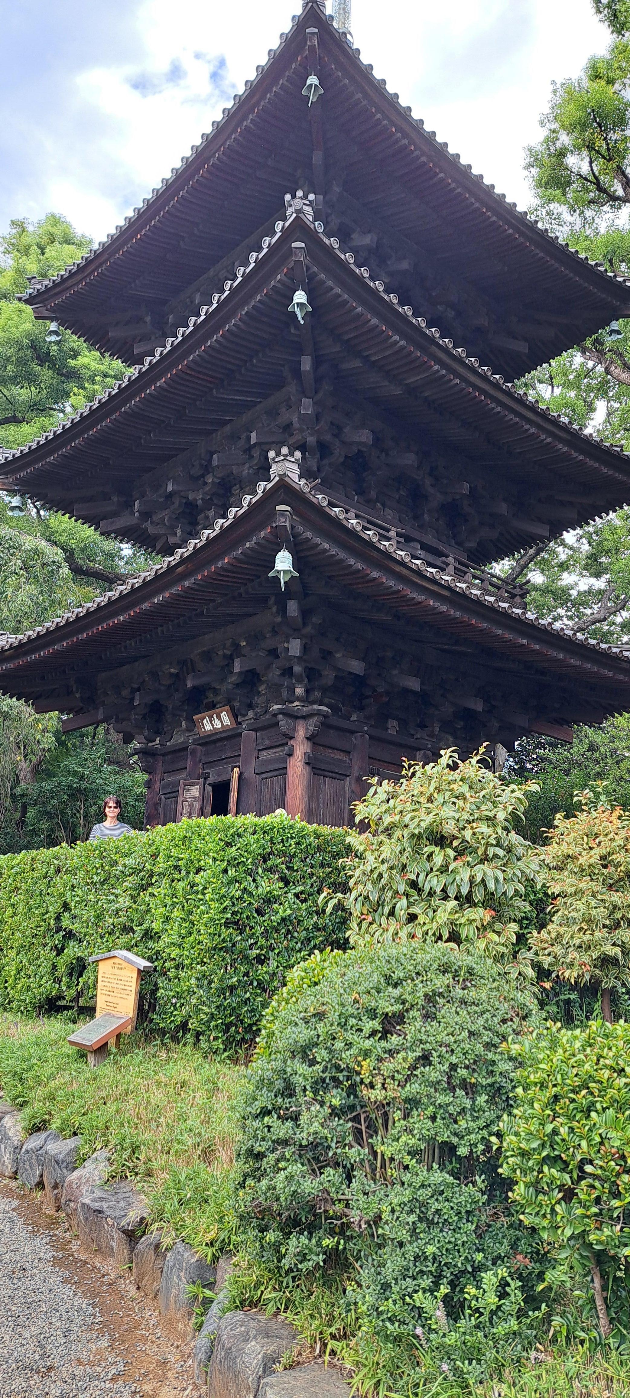 Beatutiful shrine atop the hill on surrounding garden paths