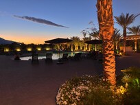 Beautifully lit back yard with sunset over mountains