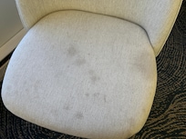 stained chairs and sofa