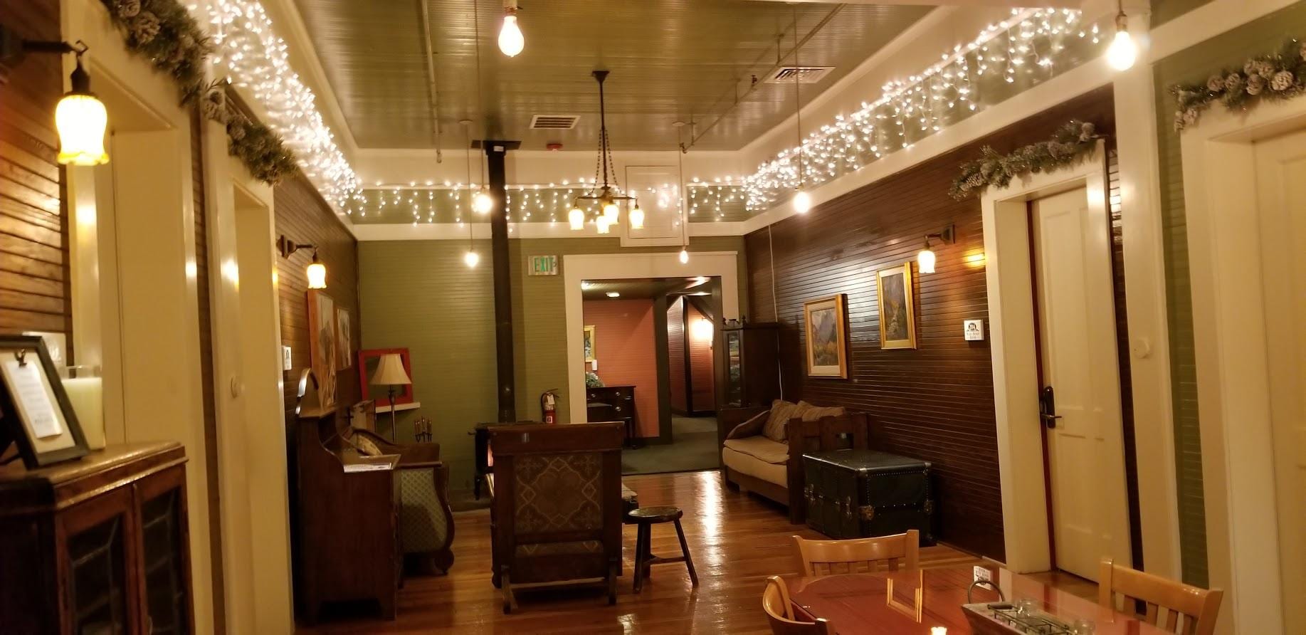 Common area, fireplace, fridge, sitting area, table.  