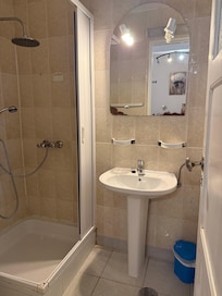 The mirror and shower stall were broken