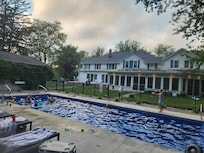 Huge pool with awesome ledges for sitting, slip-free concrete deck, and an easy-to-close cover