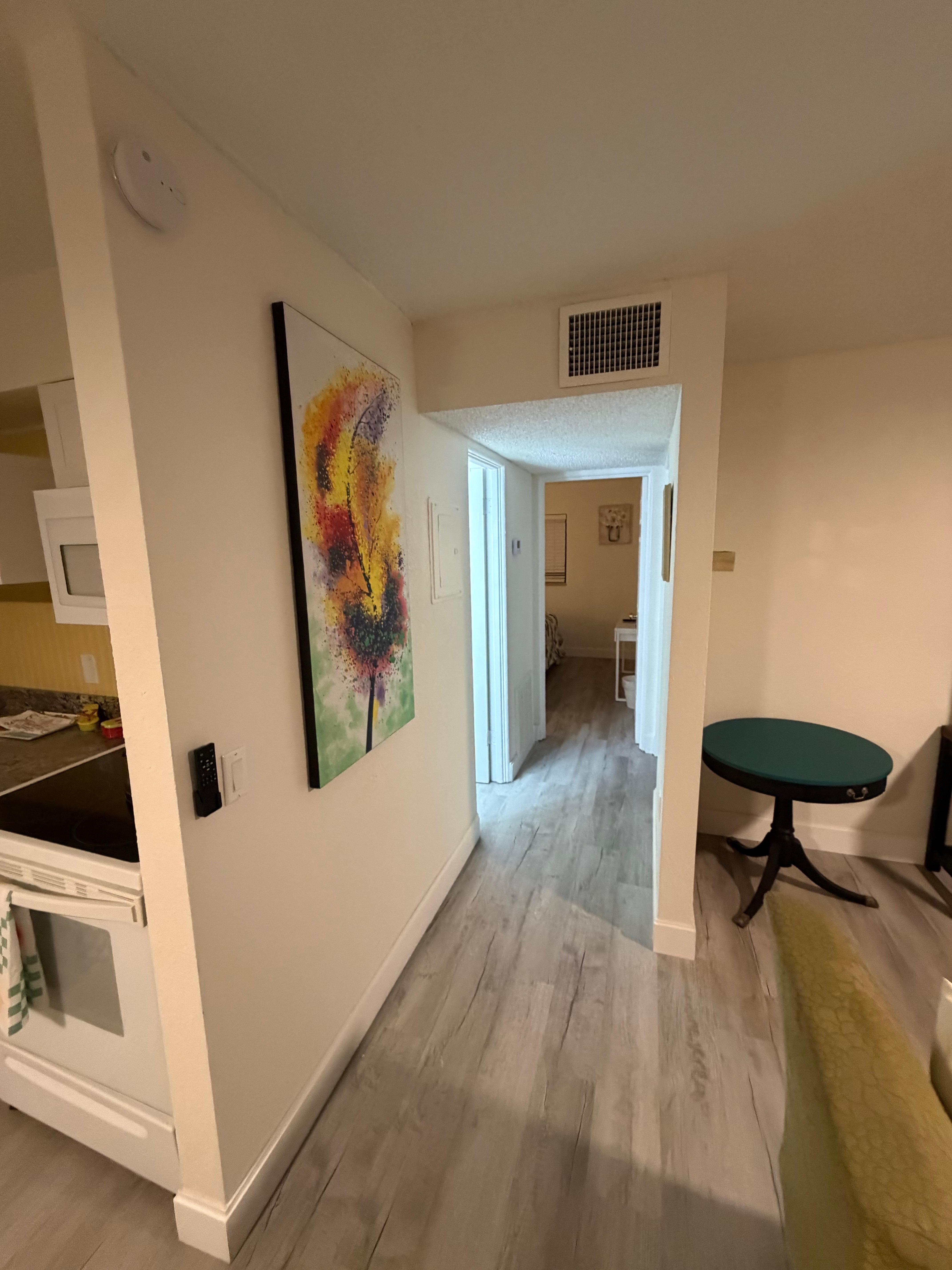 Hallway to the bathroom and two bedrooms