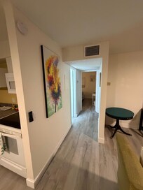 Hallway to the bathroom and two bedrooms