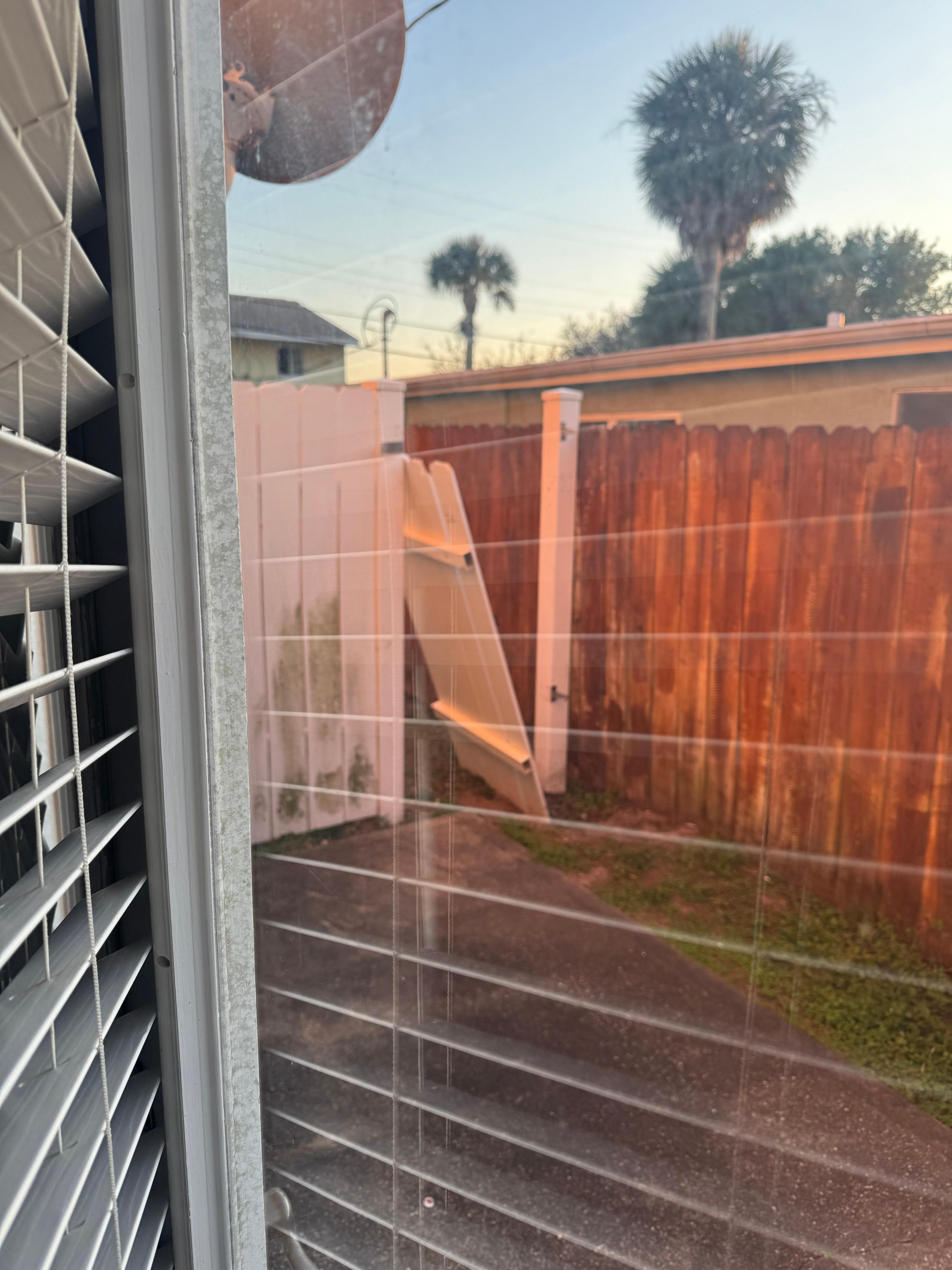 Broken down fence and access to the backyard