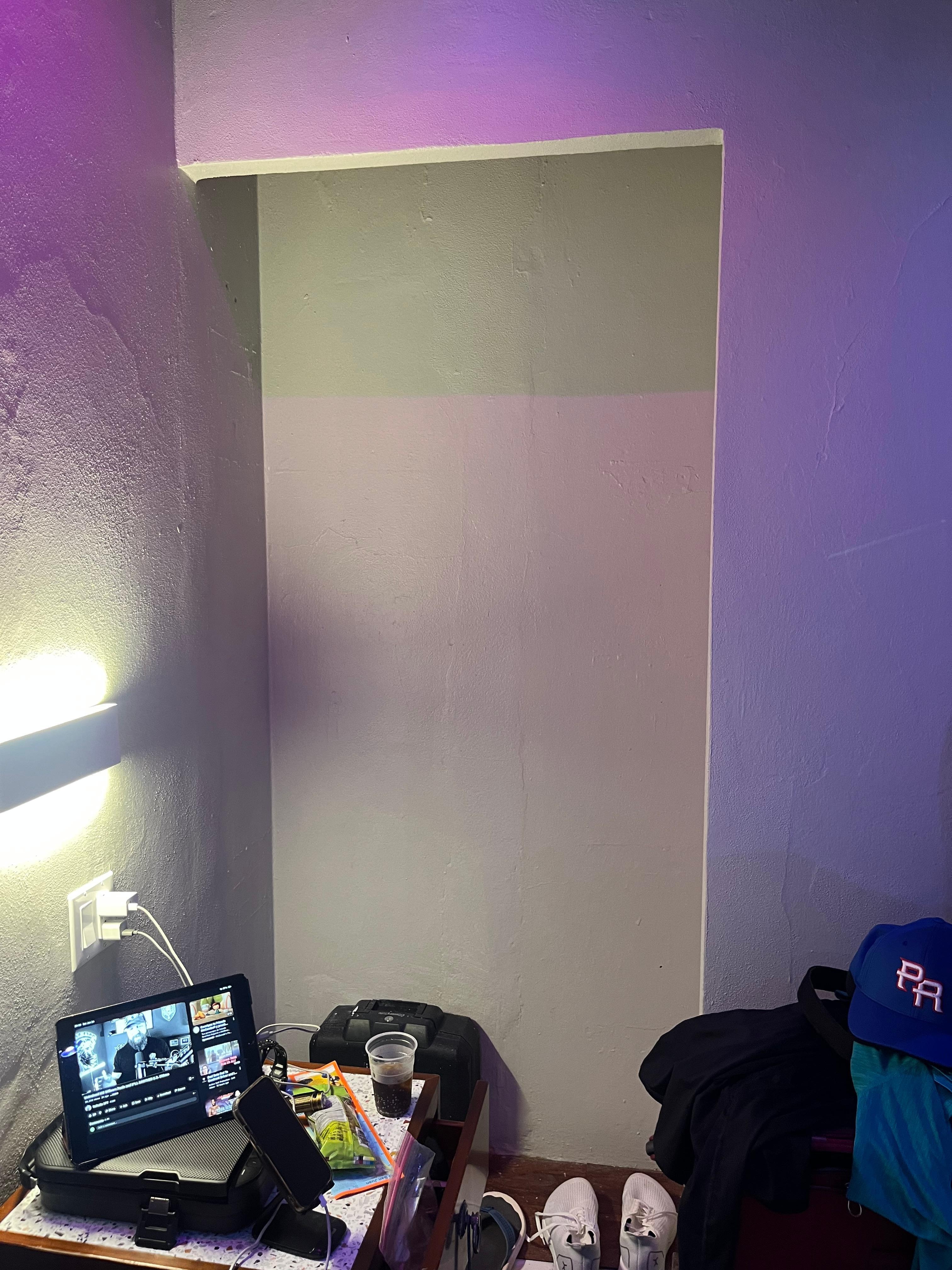 Closet with no door or rod to hang clothes in.