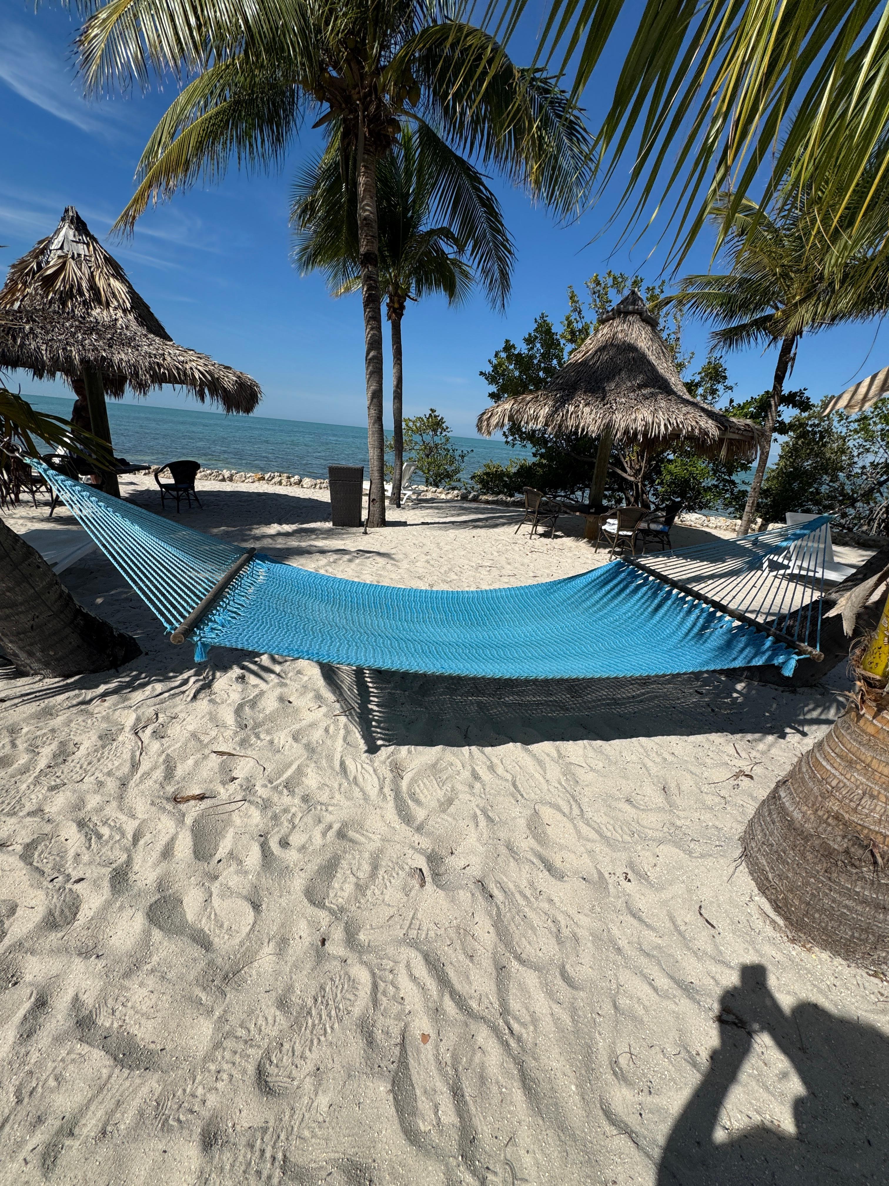 A comfortable hammock to read or fall asleep in right by the water.