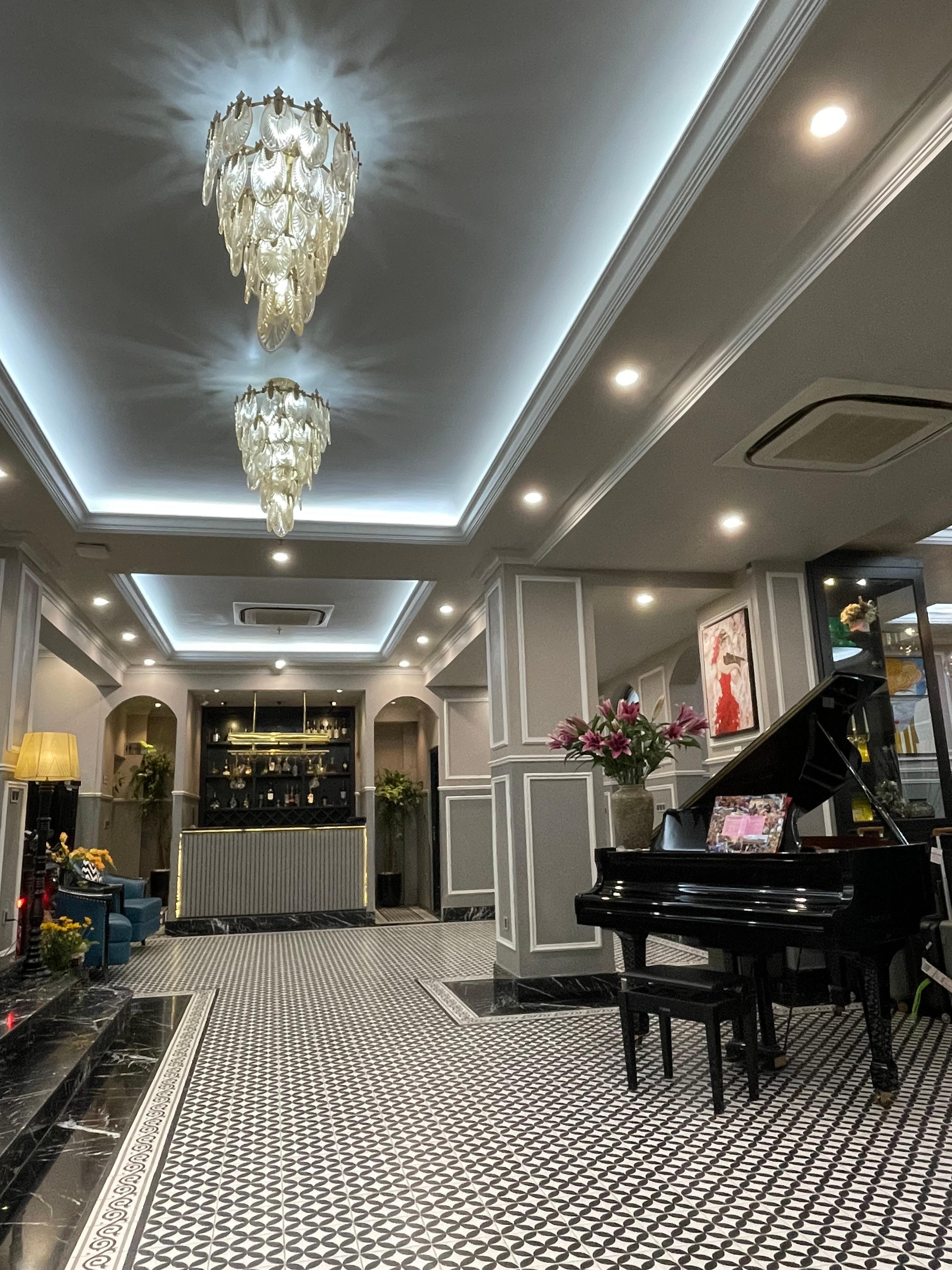 The Foyer with  a stunning piano and beautiful fresh flowers each day