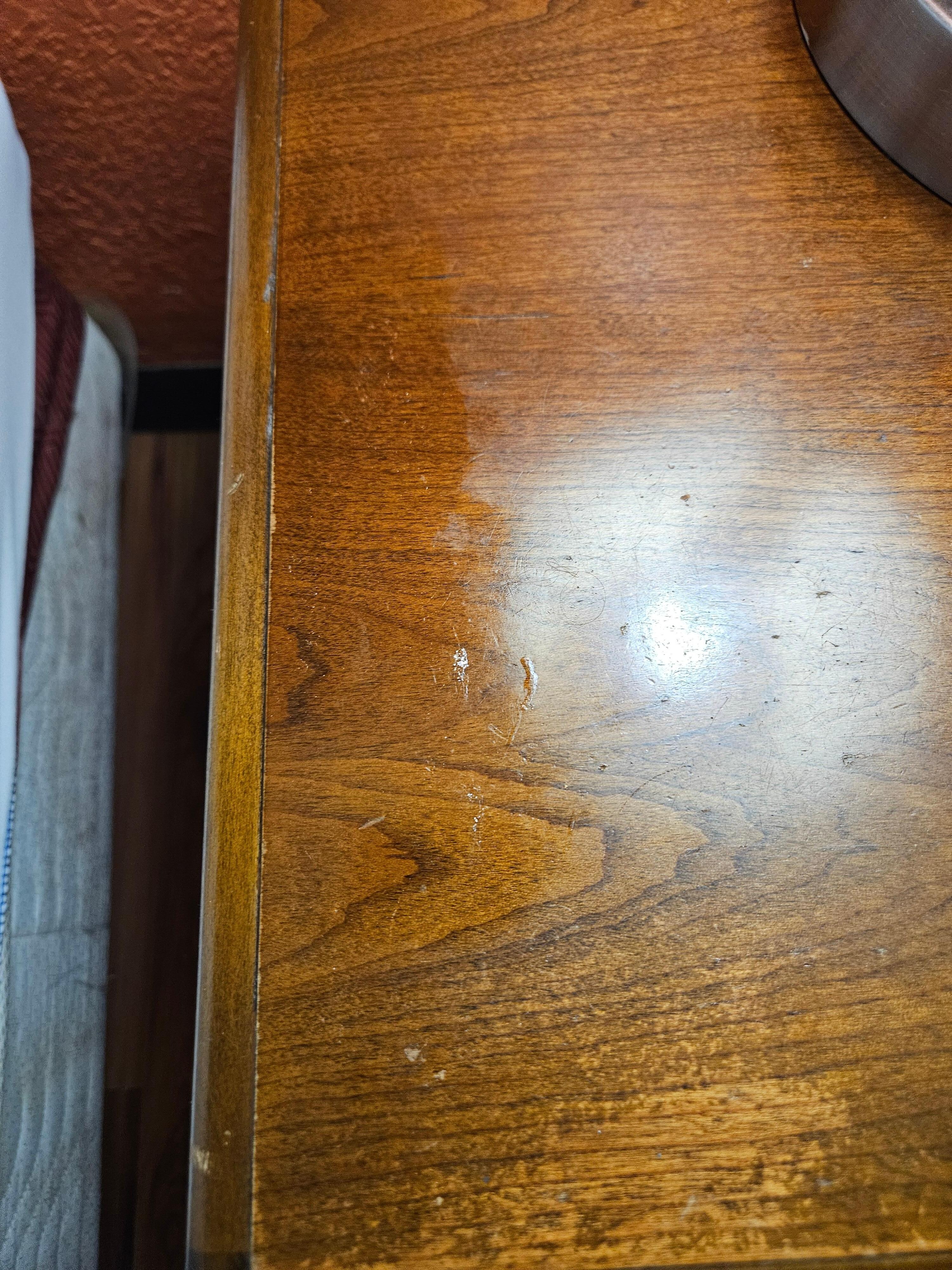 Some type of oil on night stand