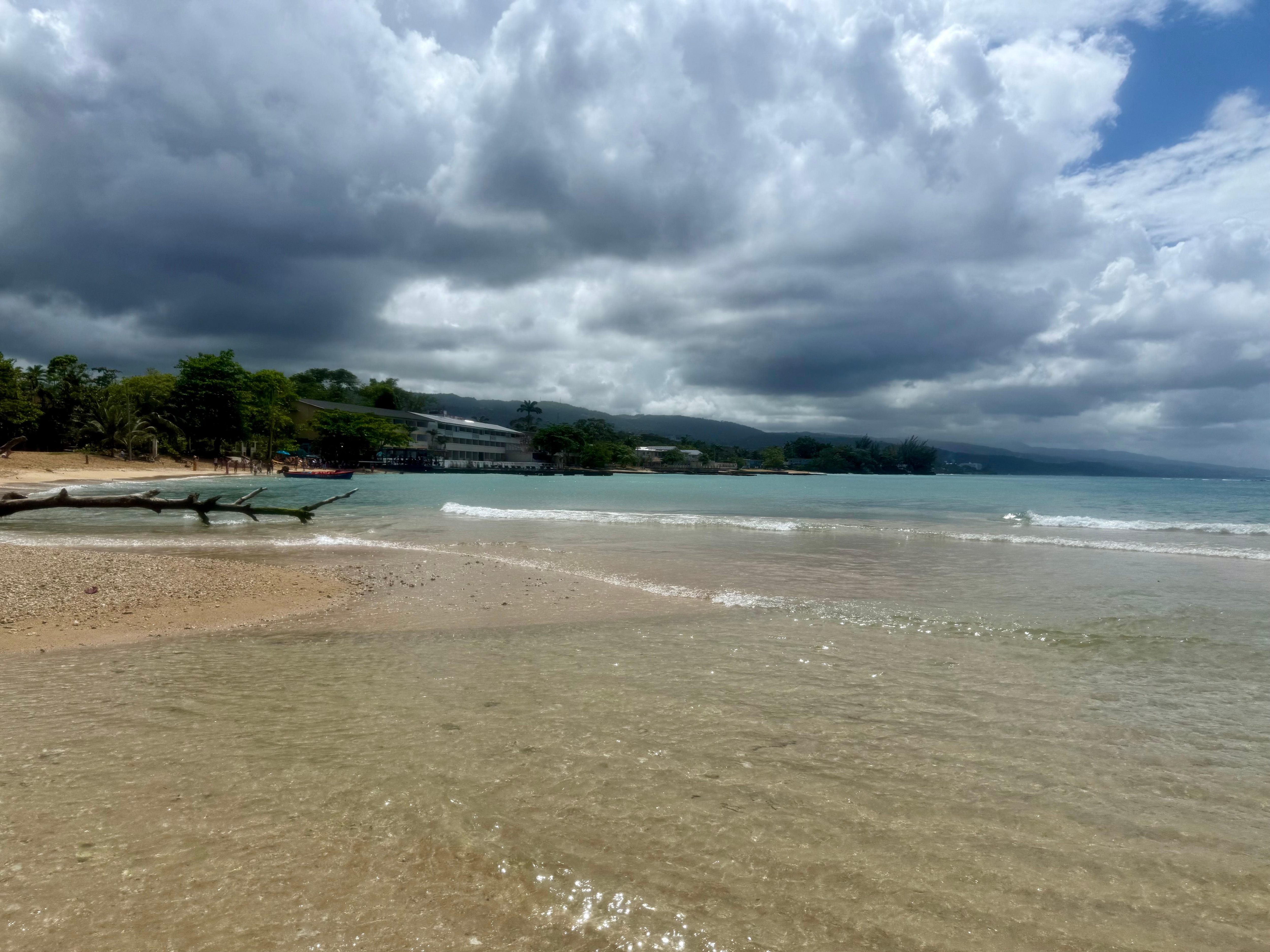 Standing where the river empties into the ocean, looking back at the hotel