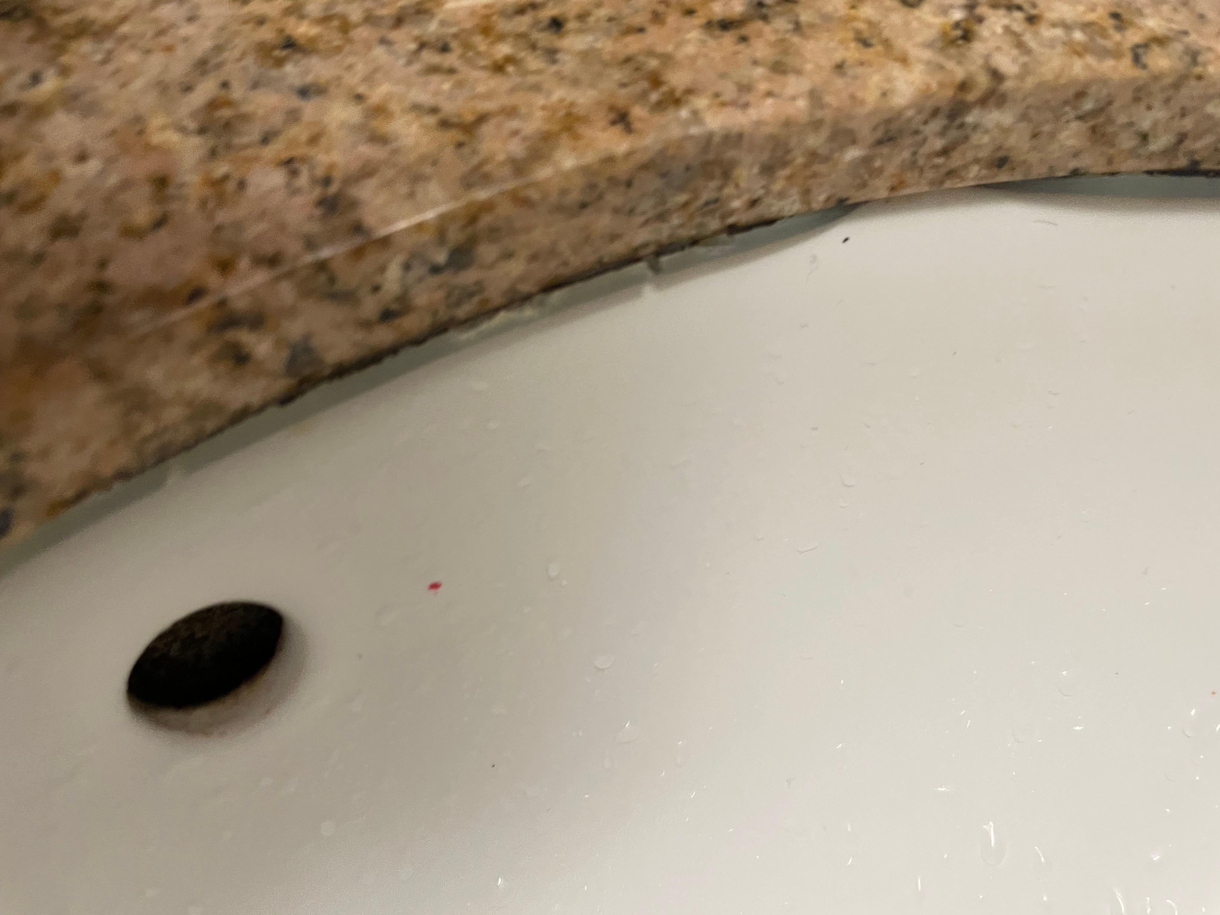 Note the mildew around the edge and old caulking. Need to replace