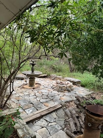Sitting area kinda of dangerous with grass and trees over growing