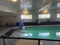 The green, disgusting pool. The hot tub was not the same color.