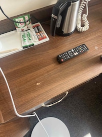 The scuffs on table under the TV