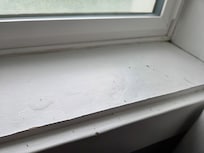 Water damage to window sill, likely from having to open the window because the HVAC doesn't work