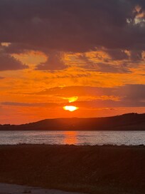 Sunset from beach in front of hotel