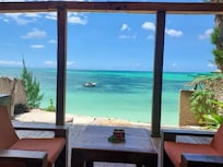 Balcony and private piece of beach.