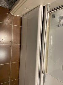 Broken tub surround.