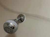 The shower head wasn't tight to the shower wall.